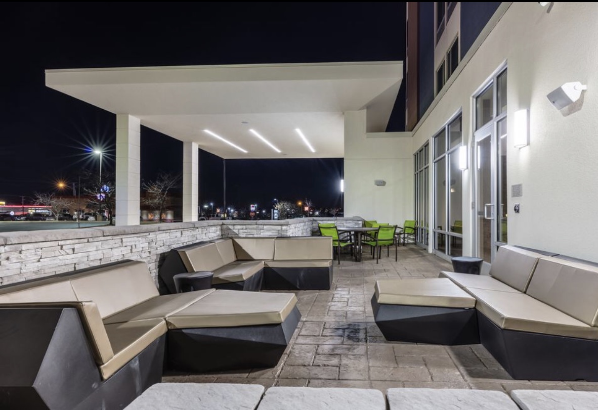 Remodeled commercial outdoor patio with replaced lighting in Missouri