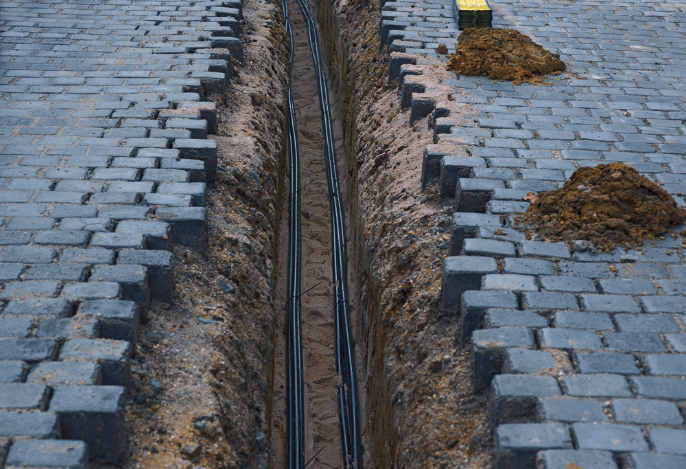 Dug up brick road with underground power lines