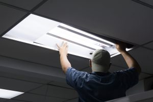 the,man,checking,or,changing,fluorescent,light,tube,in,the
