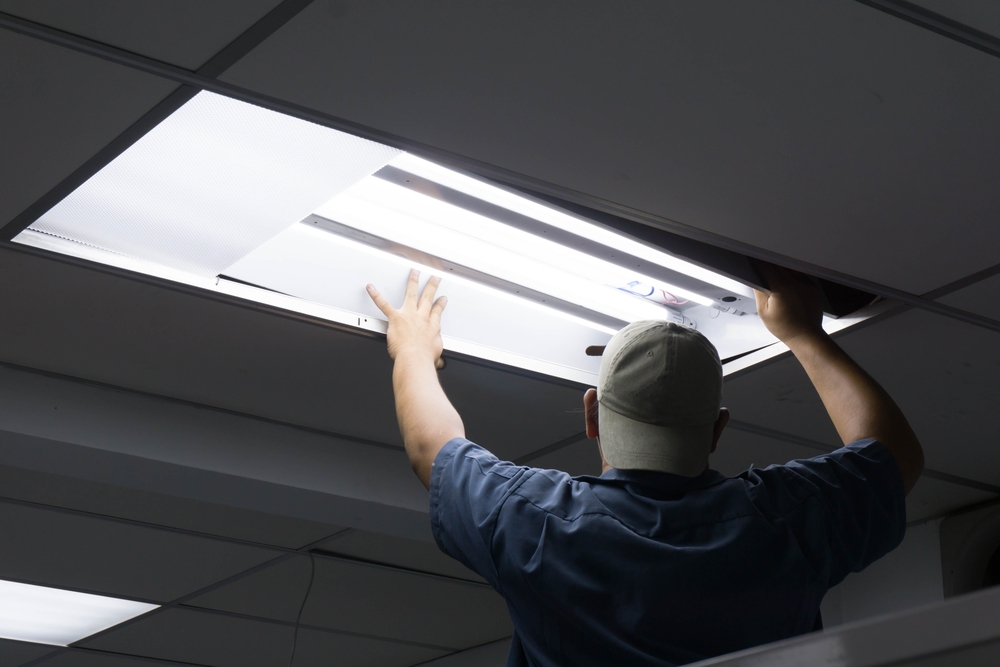 the,man,checking,or,changing,fluorescent,light,tube,in,the